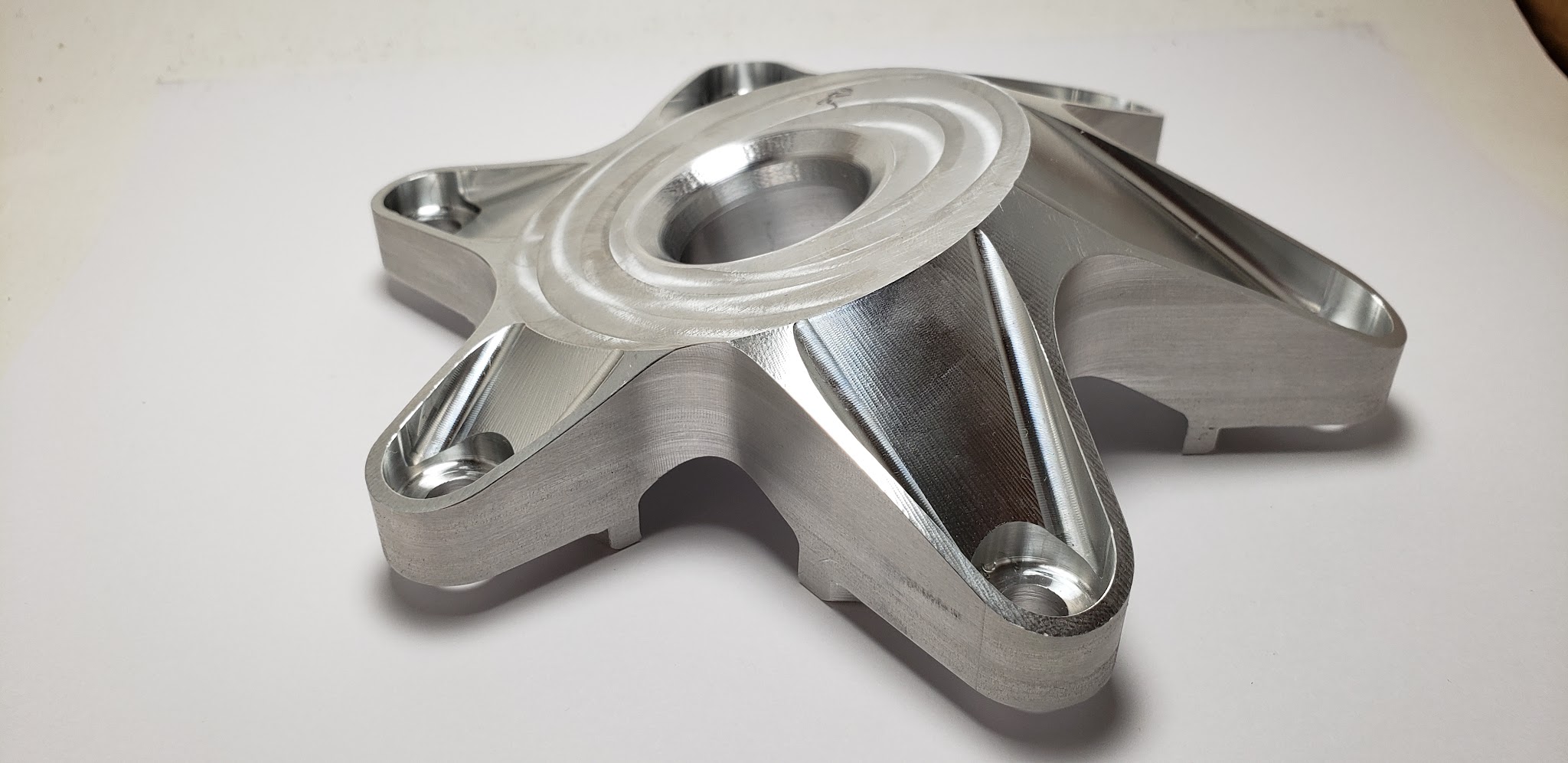 Five-spoke aluminium hub with counterbored bolt holes and machined support ribs